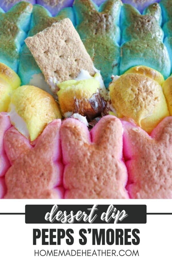 Colorful marshmallow bunnies surround a graham cracker and melted chocolate in a dessert dip. The marshmallows are pink, yellow, and blue, creating a festive appearance. Text at the bottom reads dessert dip Peeps Smores homemadeheather.com.