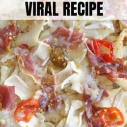 Close-up of a charcuterie chips dish, featuring melted cheese, sliced meats, jalapeños, and red pepper slices on top of chips. Bold text reads Charcuterie Chips Viral Recipe at the top and homemadeheather.com at the bottom.