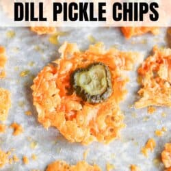 Close-up of crispy orange chips with a dill pickle slice in the center, scattered on parchment paper. The text reads 2-Ingredient Dill Pickle Chips at the top. The bottom of the image displays homemadeheather.com.