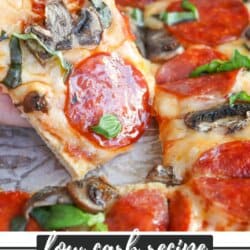 A slice of ground turkey pizza topped with pepperoni, mushrooms, and spinach is being lifted from the whole pizza. The text at the bottom reads: Low carb recipe. Ground turkey pizza. HomemadeHeather.com.
