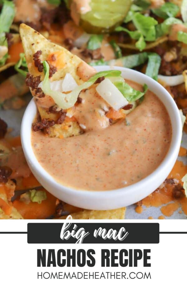 A close-up of a nacho chip topped with ground beef, lettuce, and diced onions being dipped into a creamy, orange Big Mac-style sauce. Text overlay reads: big mac nachos recipe homemadheather.com.