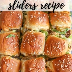 A close-up of twelve Big Mac sliders on a baking tray, topped with sesame seed buns, melted cheese, lettuce, and burger patties. Overlay text reads Big Mac sliders recipe with homemadeheather.com at the bottom.