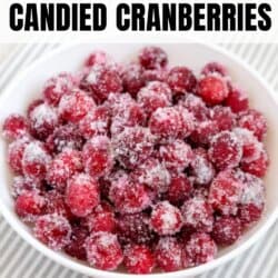 A white bowl filled with sugar-coated candied cranberries sits on a striped cloth. Text above reads How to make candied cranberries, and homemadeheather.com appears at the bottom.