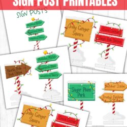 A collection of colorful printable Elf on the Shelf signposts, including directions to places like Jolly Ginger Square, Sugar Plum Park, and North Pole Post Office, displayed on a wood background.