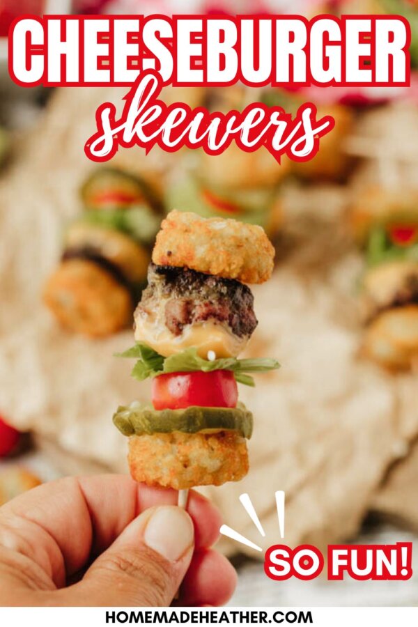 A hand holds a small cheeseburger skewer featuring tater tots, a beef patty, cheese, lettuce, tomato, and pickles. The text reads CHEESEBURGER skewers and SO FUN! above a blurred background.