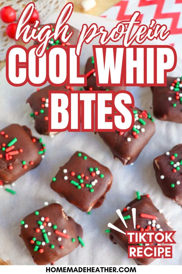 Squares of chocolate-covered treats with red, green, and white sprinkles are arranged on parchment paper. Text on the image reads High Protein Cool Whip Bites, TikTok Recipe, and homemadeheather.com.
