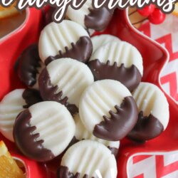 A red star-shaped dish holds several round, white orange cream candies half-dipped in chocolate. Some orange slices are visible nearby. Text reads: Chocolate Dipped Orange Creams and No Bake.