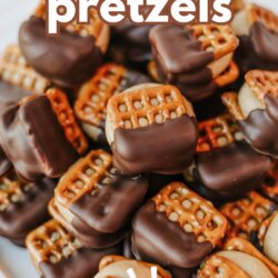 A plate of square pretzels sandwiched with a filling, half-dipped in chocolate. Text overlay reads buckeye pretzels SO GOOD and homemadeheather.com at the bottom.