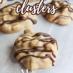Close-up of peanut butter clusters drizzled with chocolate on parchment paper, with text overlay reading peanut butter clusters and 5-Ingredients at the bottom.