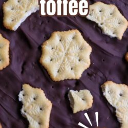 Close-up of chocolate toffee topped with snowflake-shaped Ritz crackers, broken into pieces. Text reads ritz cracker toffee at the top and SO FESTIVE! at the bottom, with homemadeheather.com in the footer.