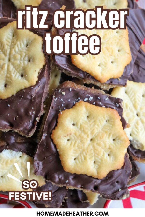 A close-up of chocolate-covered toffee topped with snowflake-shaped Ritz crackers, arranged in a festive pile. Text on the image reads: ritz cracker toffee and SO FESTIVE! homemadeheather.com.