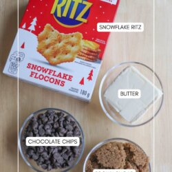 A box of Snowflake Ritz crackers, a bowl of butter, a bowl of chocolate chips, and a bowl of brown sugar are arranged on a wooden surface, each labeled with text.
