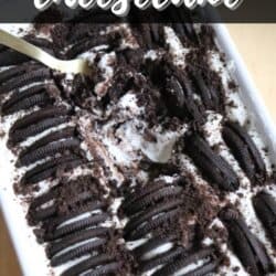 A baking dish filled with Oreo yogurt cheesecake topped with whole and crushed Oreos. A fork is taking a portion from one corner. Text at the top reads, “2-Ingredient Oreo Yogurt Cheesecake.”.