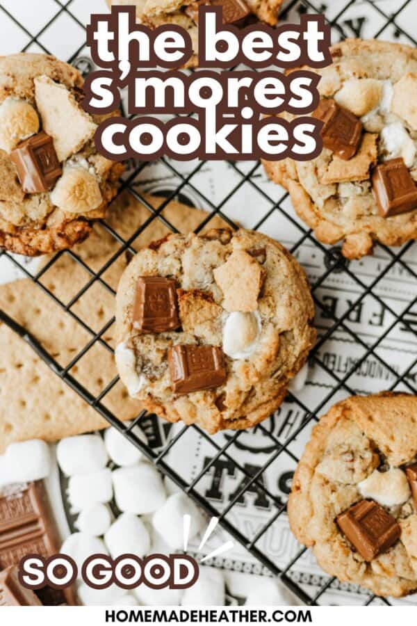 A cooling rack holds several smores cookies topped with chunks of chocolate, graham crackers, and mini marshmallows. Text reads the best smores cookies and so good, with ingredients displayed nearby.
