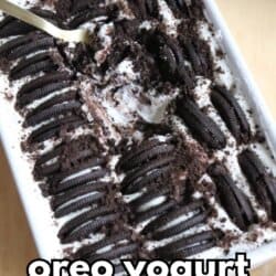 A rectangular dish filled with Oreo yogurt cheesecake, topped with rows of Oreo cookies and crumbs, with a spoon scooping some out. Text on the image reads 2-ingredient oreo yogurt cheesecake.