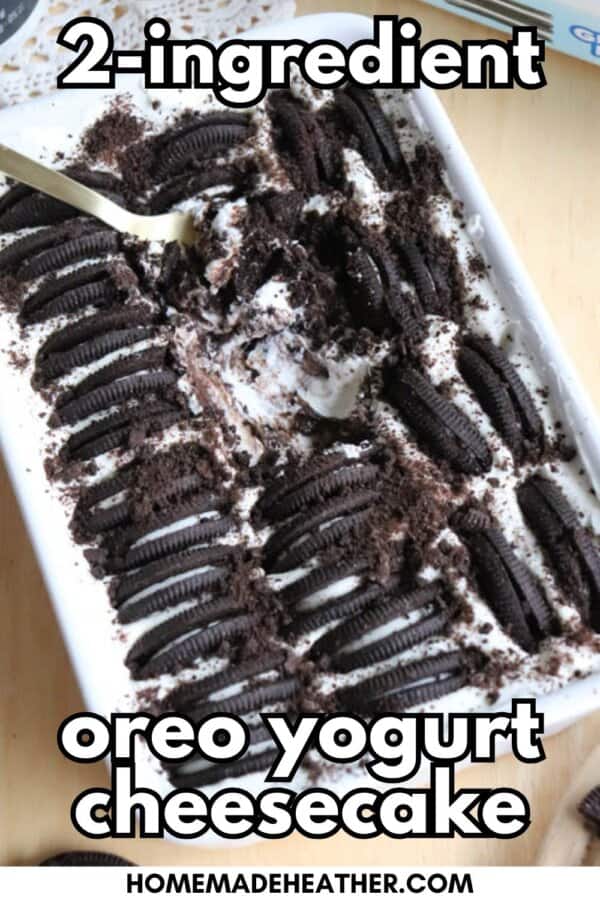 A rectangular dish filled with Oreo yogurt cheesecake, topped with rows of Oreo cookies and crumbs, with a spoon scooping some out. Text on the image reads 2-ingredient oreo yogurt cheesecake.