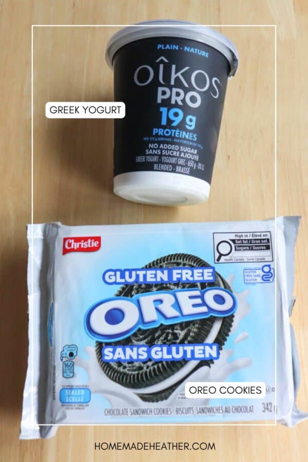 A container of Oikos Pro Greek yogurt and a package of gluten free Oreo cookies are placed on a wooden surface. The items are labeled with text indicating Greek Yogurt and Oreo Cookies.