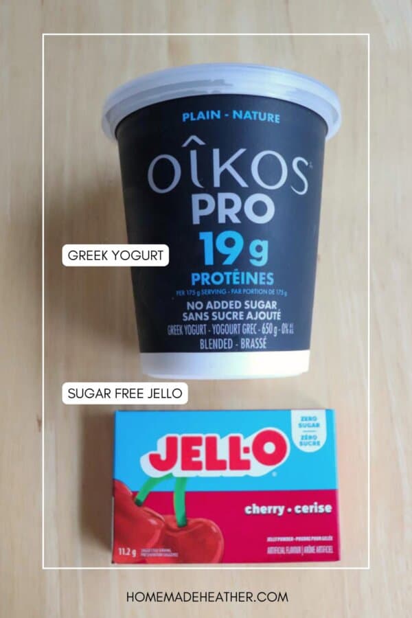 A container of Oikos Pro plain Greek yogurt and a box of Jell-O sugar free cherry gelatin are placed side by side on a light wooden surface. Labels identify each item.