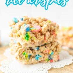 Three marshmallow cereal treats made with Lucky Charms and Rice Krispies are stacked on a doily. Blue and white text above reads “Lucky Charms rice krispies.” Bottom text says So easy! and homemadeheather.com.
