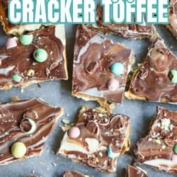 Rectangular pieces of chocolate toffee topped with pastel mini eggs and swirls of white and milk chocolate on parchment paper. Text overlay reads: โMini Egg Cracker Toffee โ So Good!โ.