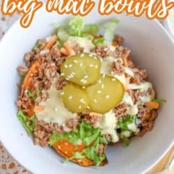 A bowl filled with ground beef, shredded lettuce, carrots, sliced pickles, and a creamy sauce over sweet potato chunks. The text reads: Sweet Potato Big Mac Bowls - So Good! homemadeheather.com.