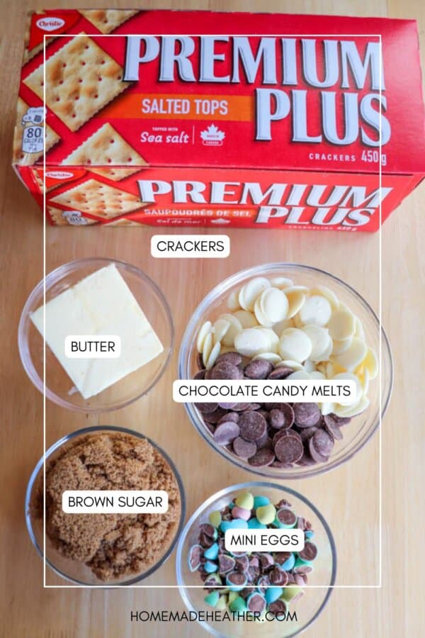 A labeled top view of ingredients on a wooden surface: a box of crackers, bowls of butter, chocolate candy melts, brown sugar, and mini eggs. The image source is homemadheather.com.