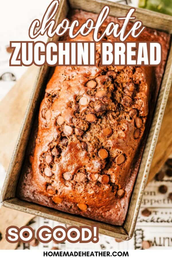 A loaf of chocolate zucchini bread topped with chocolate chips sits in a metal baking pan, with Chocolate Zucchini Bread and So Good! written on the image. The website homemadHeather.com appears at the bottom.