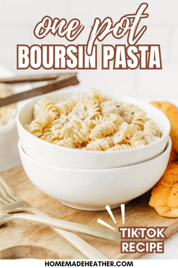 A white bowl filled with creamy rotini pasta sits on a wooden board beside pieces of bread. Text reads: One Pot Boursin Pasta, TikTok Recipe. Website homemadeheather.com appears at the bottom.