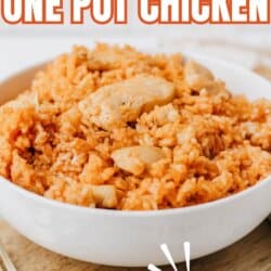 A white bowl filled with orange-colored rice and chicken pieces, labeled Sweet & Savory One Pot Chicken and TikTok Recipe. The website homemadetheather.com is at the bottom. A fork is next to the bowl.