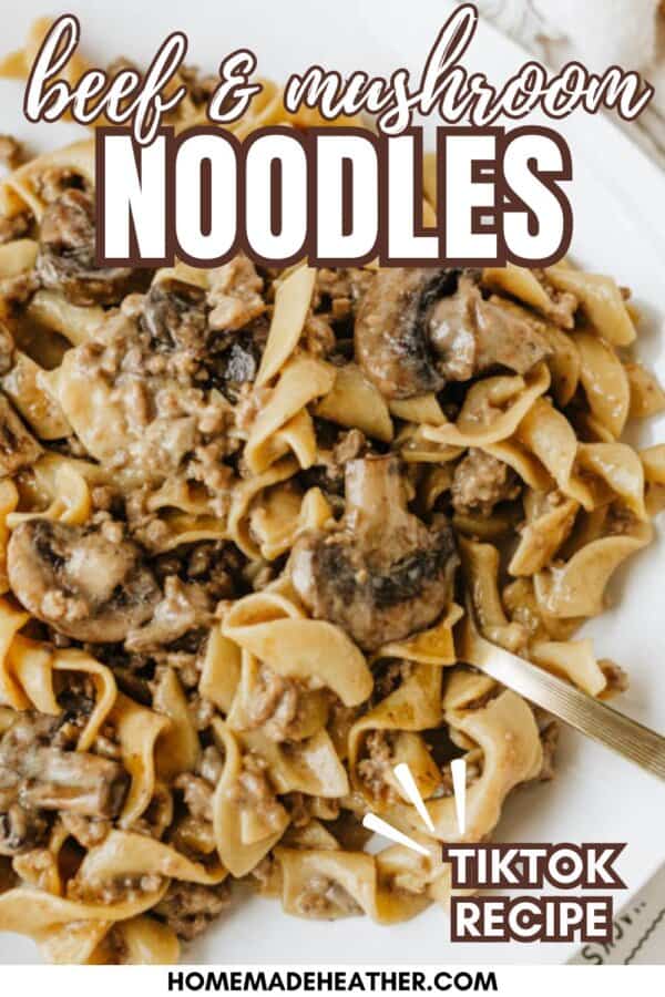 A plate of beef and mushroom noodles made with wide egg noodles, ground beef, and mushrooms in a creamy sauce. Text overlay reads: โbeef & mushroom NOODLES, TikTok recipe, homemadeheather.com.โ.