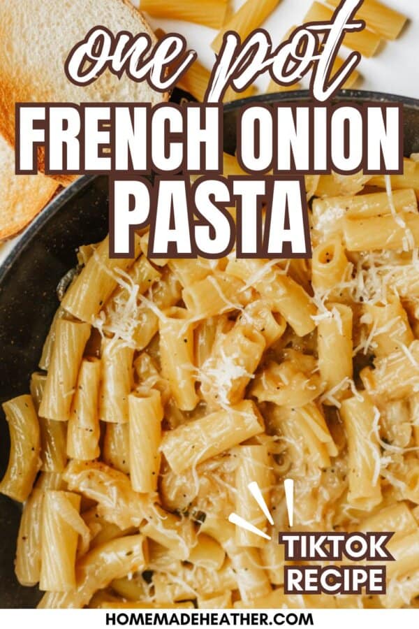 Close-up of creamy French onion pasta in a skillet, topped with shredded cheese. Text overlay reads One Pot French Onion Pasta and Tiktok Recipe with a website link at the bottom. Cooked pasta and toast are partially visible.