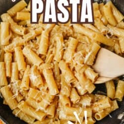 A skillet filled with creamy rigatoni pasta topped with grated cheese. Text on the image reads French Onion Pasta, TikTok Recipe, and homemadeheather.com at the bottom.